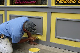 man painting wall