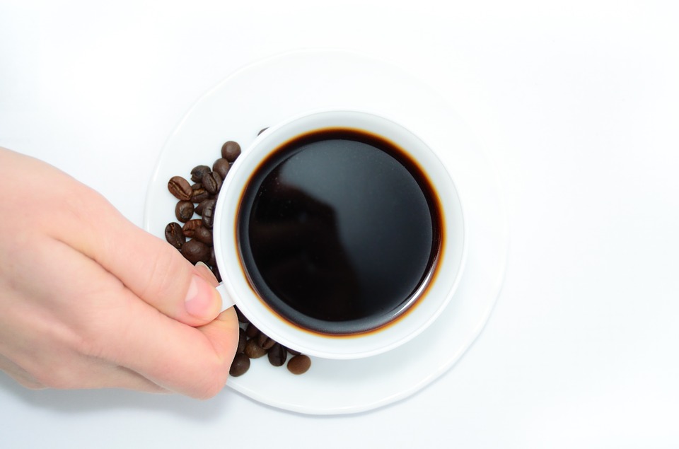 hand holding coffee